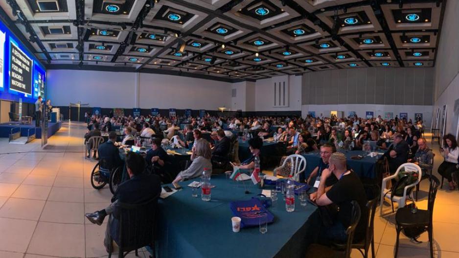 Access Israel conference with stage and audience